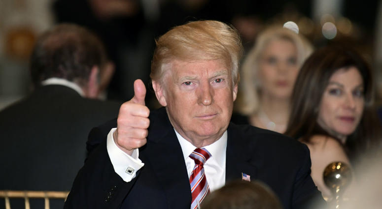 President Donald Trump gives a thumbs-up as he has Thanksgiving Day dinner at his Mar-a-Lago estate in Palm Beach, Fla., Thursday, Nov. 22, 2018. President Donald Trump gives a thumbs-up as he has Thanksgiving Day dinner at his Mar-a-Lago estate in Palm Beach, Fla., Thursday, Nov. 22, 2018.