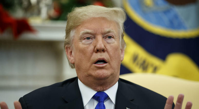 In this Dec. 11, 2018 photo, President Donald Trump speaks during a meets with Democratic leaders the Oval Office in Washington. In this Dec. 11, 2018 photo, President Donald Trump speaks during a meets with Democratic leaders the Oval Office in Washington.