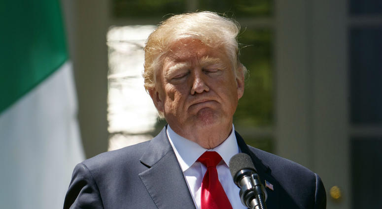 President Donald Trump pauses during a during a news conference with Nigerian President Muhammadu Buhari in the Rose Garden of the White House in Washington, Monday, April 30, 2018. President Donald Trump