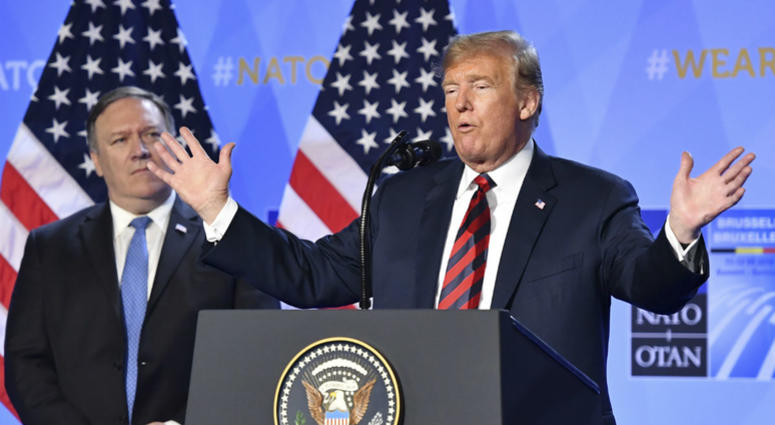 U.S. President Donald Trump raises his hands during a press conference after a summit of heads of state and government at NATO headquarters in Brussels, Belgium, Thursday, July 12, 2018. U.S. President Donald Trump raises his hands during a press conference after a summit of heads of state and government at NATO headquarters in Brussels, Belgium, Thursday, July 12, 2018.