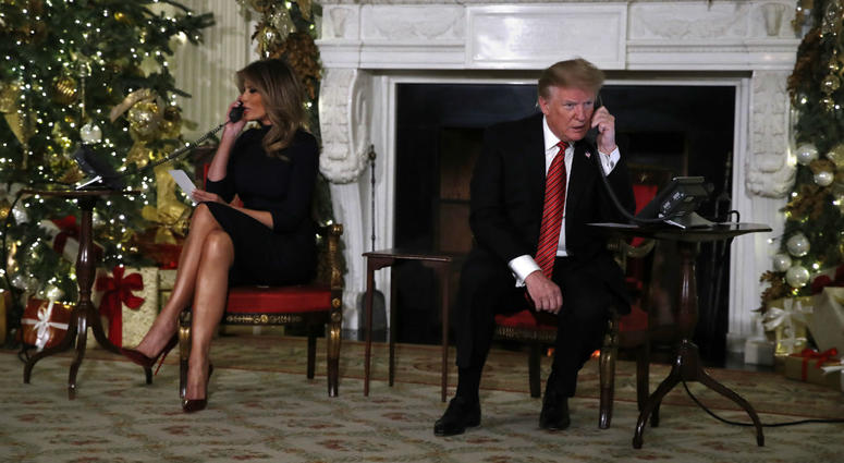 President Donald Trump and first lady Melania Trump each speak on the phone sharing updates to track Santa's movements from the North American Aerospace Defense Command (NORAD) Santa Tracker on Christmas Eve, Monday, Dec. 24, 2018. President Donald Trump and first lady Melania Trump each speak on the phone sharing updates to track Santa's movements from the North American Aerospace Defense Command (NORAD) Santa Tracker on Christmas Eve, Monday, Dec. 24, 2018.
