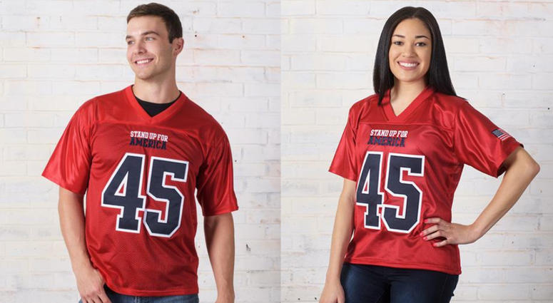 The jersey, sold on the president’s campaign website for $99, says “STAND UP FOR AMERICA” on the front, along with Trump’s name on the back, the number 45, and an American flag patch on the sleeve. The jersey, sold on the president’s campaign website for $99, says “STAND UP FOR AMERICA” on the front, along with Trump’s name on the back, the number 45, and an American flag patch on the sleeve.