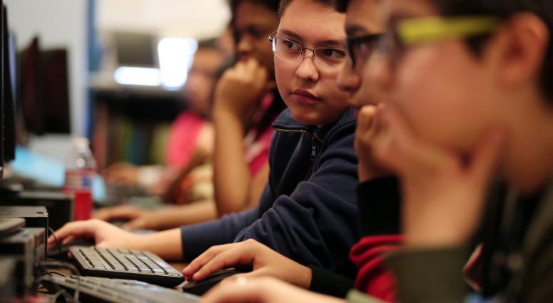 Students work during the "hour of coding" event Wednesday, Dec. 9, 2015 at Wells Community Academy High School in Chicago. Students work during the "hour of coding" event Wednesday, Dec. 9, 2015 at Wells Community Academy High School in Chicago.