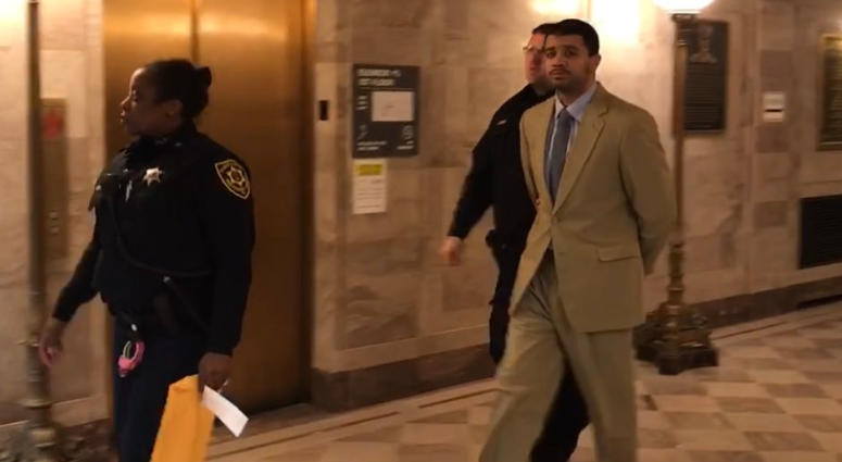 Tristian Jones (right) is escorted out of court, March 4, 2019. He has been charged with first-degree murder for allegedly killing his girlfriend and her unborn child. Tristian Jones (right) is escorted out of court, March 4, 2019.