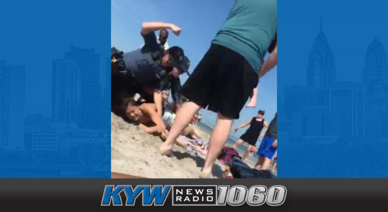 An investigation is underway after video shows a New Jersey police officer striking a woman several times during a beach arrest. An investigation is underway after video shows a New Jersey police officer striking a woman several times during a beach arrest.
