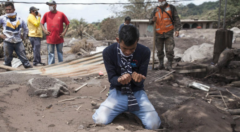 Bryan Rivera cries after looking at the remains of his house, after his family went missing during the Volcan de Fuego or "Volcano of Fire" eruption, in San Miguel Los Lotes, Guatemala, Thursday, June 7, 2018. Bryan Rivera cries after looking at the remains of his house, after his family went missing during the Volcan de Fuego or "Volcano of Fire" eruption, in San Miguel Los Lotes, Guatemala, Thursday, June 7, 2018.