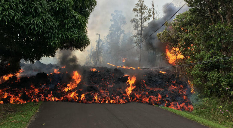 A lava flow moves on Makamae Street in Leilani Estates Sunday morning. A lava flow moves on Makamae Street in Leilani Estates Sunday morning.