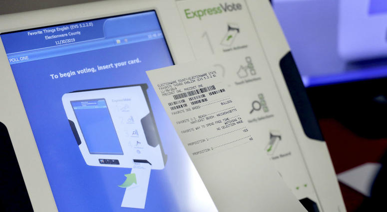 This Oct. 19, 2017, file photo shows a new voting machine which prints a paper record on display at a polling site in Conyers, Ga. This Oct. 19, 2017, file photo shows a new voting machine which prints a paper record on display at a polling site in Conyers, Ga.