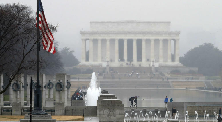 With the Lincoln Memorial in the background, an American flag at the WWII Memorial flies at half-staff, Saturday, Dec. 1, 2018, in Washington. With the Lincoln Memorial in the background, an American flag at the WWII Memorial flies at half-staff, Saturday, Dec. 1, 2018, in Washington.