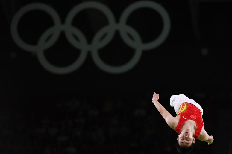 Aug 13, 2016; Rio de Janeiro, Brazil; Lei Gao (CHN) during the men's individual trampoline event in the Rio 2016 Summer Olympic Games at Rio Olympic Arena.