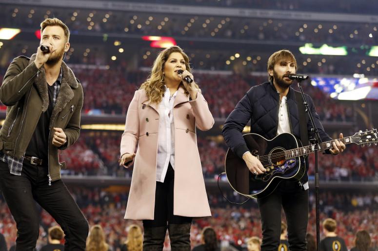 Jan 12, 2015; Arlington, TX, USA; Country recording artists Lady Antebellum sing the national anthem prior to the game between the Oregon Ducks and the Ohio State Buckeyes in the 2015 CFP National Championship Game at AT&T Stadium. Ohio State won 42-20. M