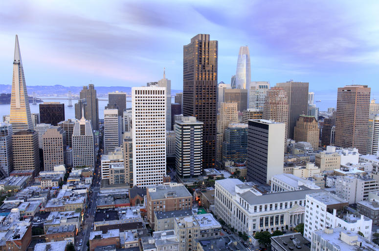 San Francisco Financial District Aerial view of San Francisco Financial District as seen from a building rooftop in Nob Hill at dusk. (Photo credit: Yuval Helfman/Dreamstime)