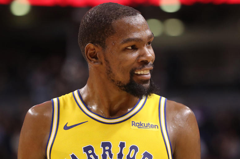 Golden State Warriors' Kevin Durant Nov 29, 2018; Toronto, Ontario, CAN; Golden State Warriors forward Kevin Durant (35) smiles as he reacts during their defeat to the Toronto Raptors at Scotiabank Arena. The Raptors beat the Warriors 131-128 in overtime. Mandatory Credit: Tom Szczerbowski-