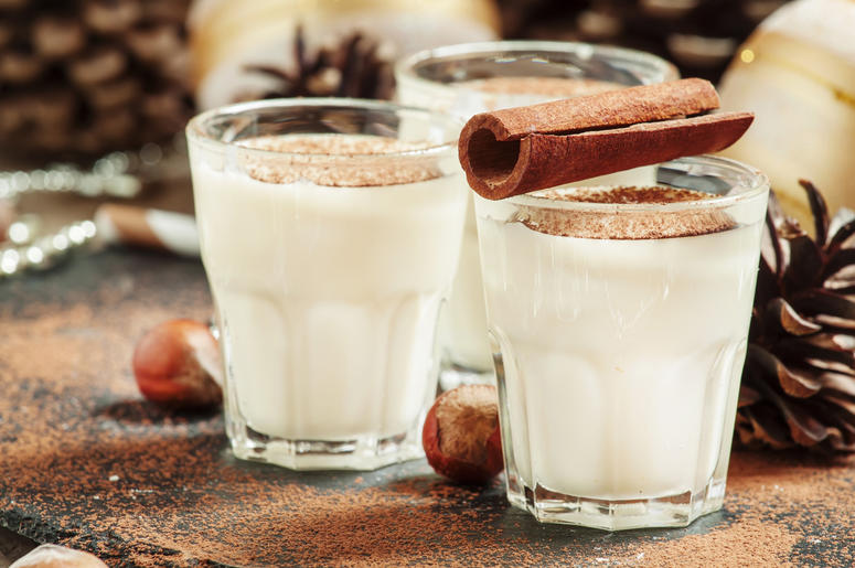 Eggnog with milk, cinnamon, grated nutmeg, decorated with fir co. Drink, alcoholic. Eggnog with milk, cinnamon, grated nutmeg, decorated with fir co. Drink, alcoholic. (Photo credit: Olga Kochina/Dreamstime)