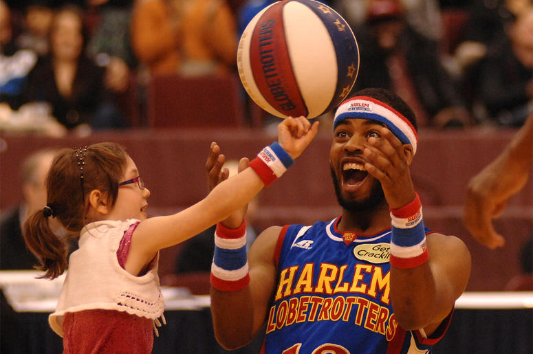 Harlem Globetrotters Harlem Globetrotters' player Ant entertains a girl during their 2014 "Fans Rule" World Tour basketball show on Feb.13, 2014 in Vancouver, Canada. The Harlem Globetrotters are an exhibition basketball team that combines athleticism, theater and comedy. Ove
