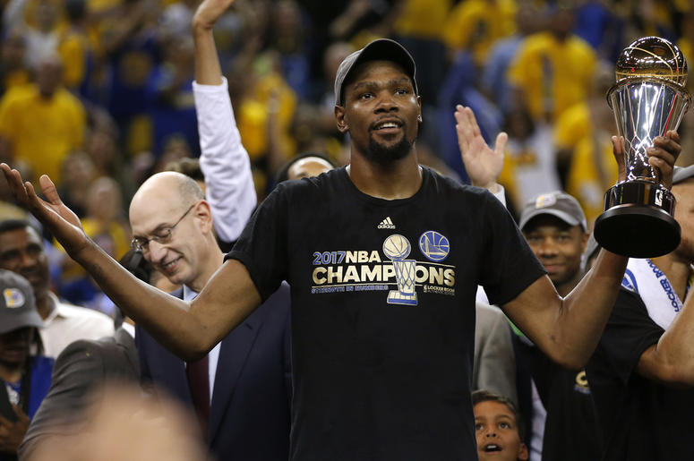 Kevin Durant The Golden State Warriors' Kevin Durant holds the Finals MVP trophy after defeating the Cleveland Cavaliers, 129-120, in Game 5 of the NBA Finals at Oracle Arena in Oakland, Calif., on Monday, June 12, 2017.