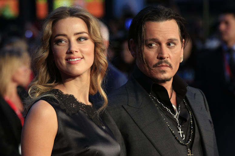 Amber Heard and Johnny Depp 12/8/2017 - File photo dated 11/10/15 of Amber Heard and Johnny Depp. Amber Heard has spoken out after JK Rowling defended her decision to keep Johnny Depp in the Fantastic Beasts sequel. (Photo by PA Images/Sipa USA)