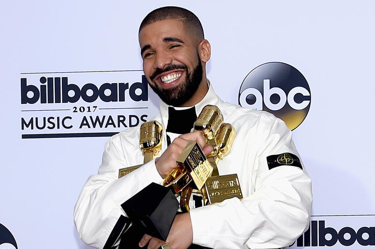 Drake at Billboard Music Awards LAS VEGAS, NV - MAY 21: Rapper Drake poses in the press room with his awards for Top Artist, Top Male Artist, Top Billboard 200 Artist, Top Billboard 200 Album for 'Views,' Top Hot 100 Artist, Top Song Sales Artist, Top Streaming Artist, Top Streaming Son