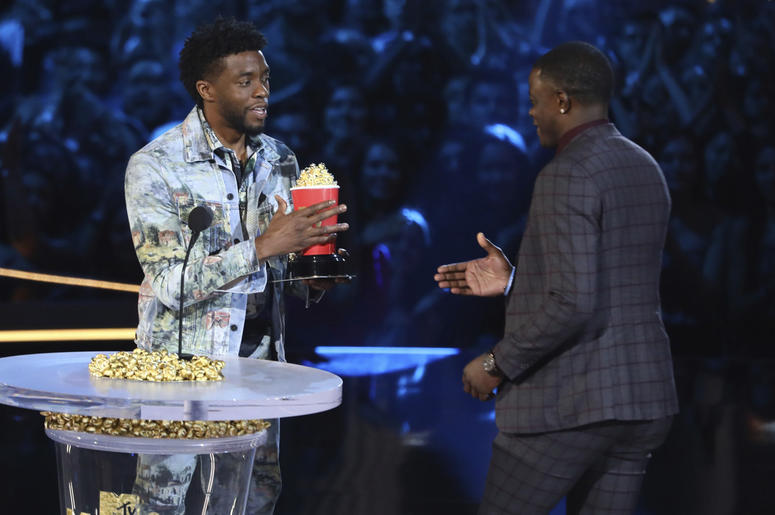 Chadwick Boseman, left, gives his best hero award for his role in "Black Panther" to James Shaw Jr. Chadwick Boseman, left, gives his best hero award for his role in "Black Panther" to James Shaw Jr.