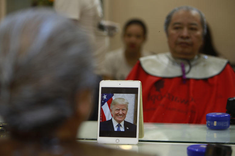 e Phuc Hai, 66, receives a Trump haircut in Hanoi, Vietnam, on Tuesday, Feb. 19, 2019. U.S. President Donald Trump and North Korean leader Kim Jong Un have become the latest style icons in Hanoi, a week before their second summit is to be held in the capi