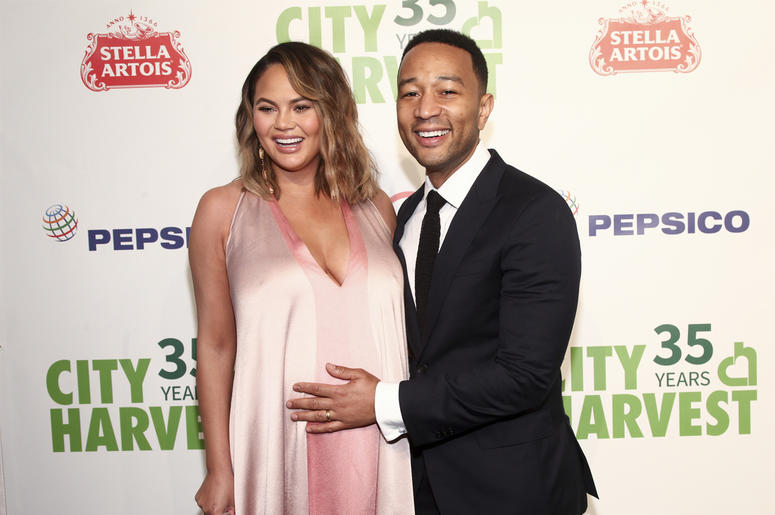 AP18140786658090 In this Tuesday, April 24, 2018, file photo, Chrissy Teigen, left, and John Legend attend City Harvest's 35th Anniversary Gala at Cipriani 42nd Street on in New York. Teigen and Legend now have a baby boy to go with their toddler girl. The couple introduc