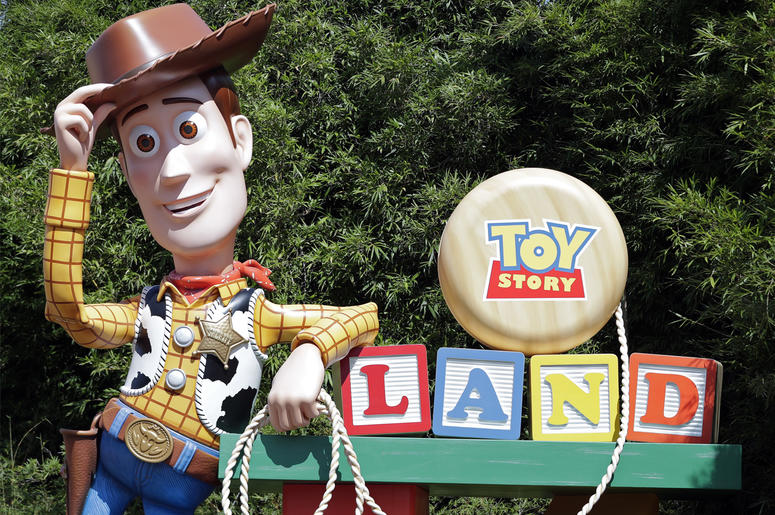 AP18176752365742 In this Saturday, June 23, 2018 photo, a statue of the character Sheriff Woody greets visitors at the entrance Toy Story Land in Disney's Hollywood Studios at Walt Disney World in Lake Buena Vista, Fla