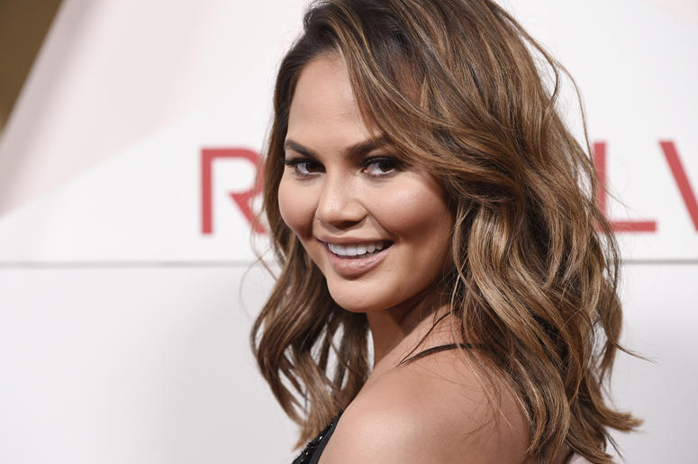 AP18217789323146 In this Nov. 2, 2017 file photo, model Chrissy Teigen poses at the 2017 Revolve Awards at the Dream Hollywood hotel in Los Angeles. Chrissy Teigen has shared her shock and worry in real-time during a powerful and deadly earthquake in Indonesia with her so