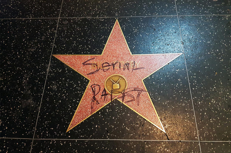 AP18248633685168 This Monday, Sept. 3, 2018 photo shows Bill Cosby's star on the Hollywood Walk of Fame in Los Angeles after it was vandalized by someone who scrawled the words "serial rapist" on it. Cosby was convicted in Philadelphia this year of aggravated indecent
