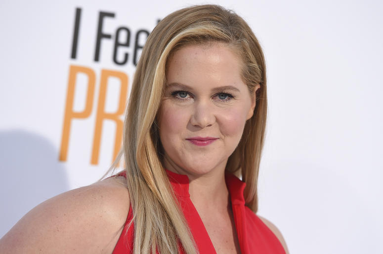 AP18293563204071 In this April 17, 2018 file photo, Amy Schumer arrives at the world premiere of "I Feel Pretty" at the Westwood Village Theater in Los Angeles. Schumer says don’t look for her in a Super Bowl commercial this time around. She’s sitting this one out in supp