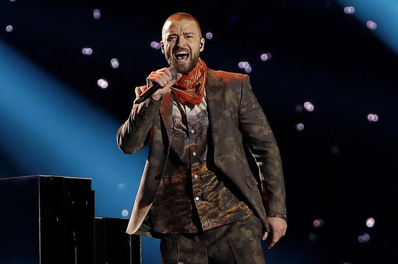 AP18297747569931 In this Feb. 4, 2018 file photo, Justin Timberlake performs during halftime of the NFL Super Bowl 52 football game in Minneapolis. Timberlake says he is postponing his Wednesday night concert in New York City because his vocal chords are “severely bruised