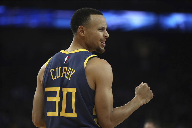 AP18352161078983 Golden State Warriors' Stephen Curry celebrates a score against the Memphis Grizzlies during the first half of an NBA basketball game Monday, Dec. 17, 2018, in Oakland, Calif. (AP Photo/Ben Margot)
