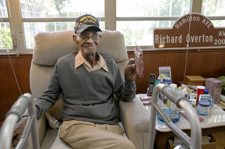 AP18362070581131 In this May 10, 2018 photo Richard Overton, the oldest living U.S. Veteran at the age of 111, is back in the east Austin home he has owned since 1948 after a renovation provided by Meals on Wheels of Central Texas and the Home Depot Foundation. A family m