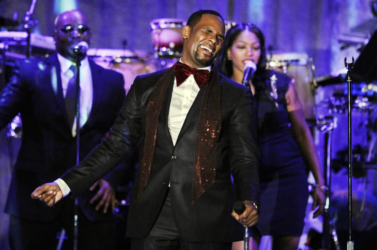 AP19010669812098 This Feb. 12, 2011 file photo shows R. Kelly performing at the pre-Grammy gala & salute to industry icons with Clive Davis honoring David Geffen in Beverly Hills, Calif. Kelly, one of the top-selling recording artists of all time, has been hounded for yea