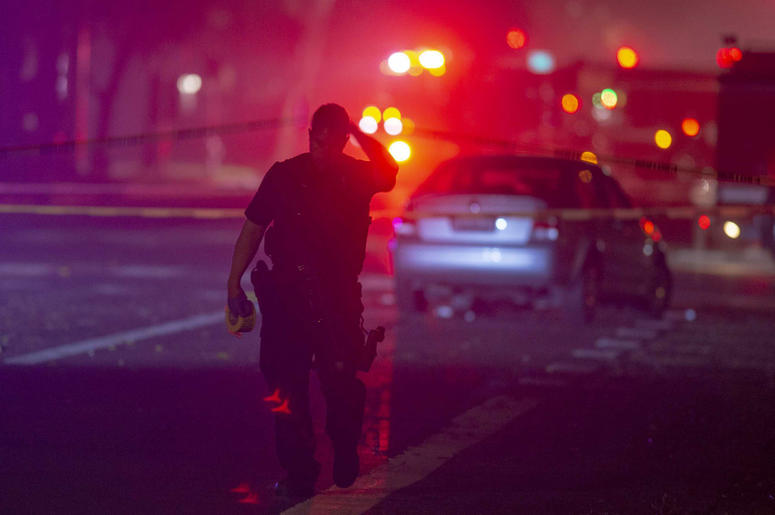 AP19011229043637 Davis Police closed the area near 5th and C streets in Davis, Calif., after a police officer was shot on Thursday, Jan. 10, 2019. A Davis police officer was shot Thursday night while responding to a traffic accident, and authorities cordoned off parts of