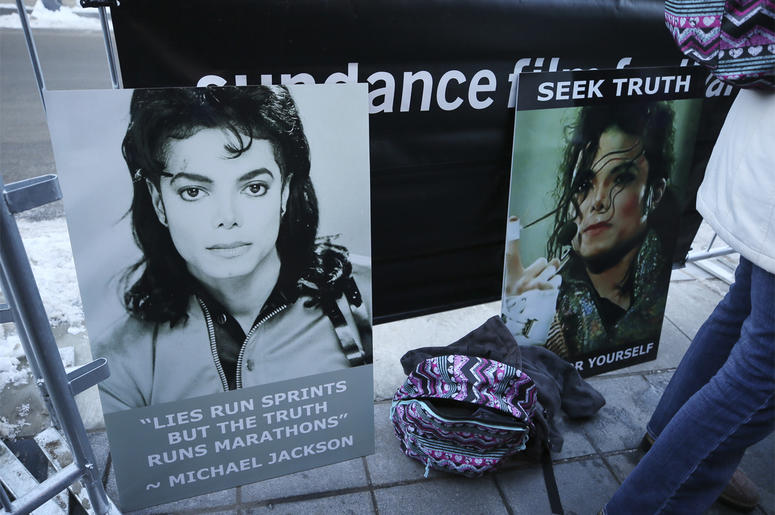 AP19025645016961 Signs in support of Michael Jackson are seen outside of the premiere of the "Leaving Neverland" Michael Jackson documentary film at the Egyptian Theatre on Main Street during the 2019 Sundance Film Festival, Friday, Jan. 25, 2019, in Park City, Utah. (Pho