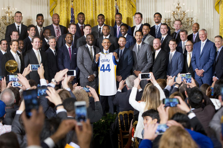 AP19025779231833 In this Feb. 4, 2016, file photo, President Barack Obama holds up Golden State Warrior basketball jersey given to him by team members during a ceremony in the East Room of the White House in Washington where he honored the 2015 NBA Champions. The Warriors