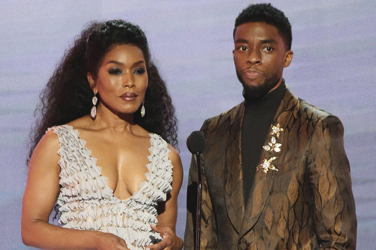 AP19042241027121 In this Jan. 27, 2019, file photo, Angela Bassett, left, and Chadwick Boseman, nominated for outstanding performance by a cast in a motion picture, introduce a clip from their film "Black Panther" at the 25th annual Screen Actors Guild Awards at the Shrin