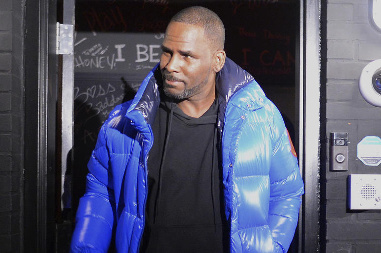 AP19054157579607 Musician R. Kelly leaves his Chicago studio on his way to surrender to police Friday night, Feb. 22, 2019. R&B star Kelly arrived Friday night at a Chicago police precinct, hours after authorities announced multiple charges of aggravated sexual abuse invo