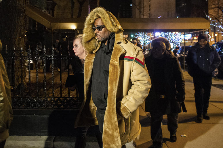 AP19057533649156 R. Kelly walks to his vehicle after exiting a cigar lounge in Chicago on Monday, Feb. 25, 2019. A suburban Chicago woman posted the $100,000 bail for R. Kelly to be freed from jail while he awaits trial on sexual abuse charges. (Tyler LaRiviere/Chicago Su