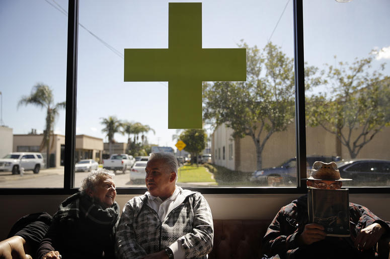 AP19075024690566 In this Feb. 19, 2019 photo, Kay Nelson, left, and Bryan Grode, retried seniors from Laguna Woods Village, chat in the lobby of Bud and Bloom cannabis dispensary while waiting for a free shuttle to arrive in Santa Ana, Calif. (AP Photo/Jae C. Hong)