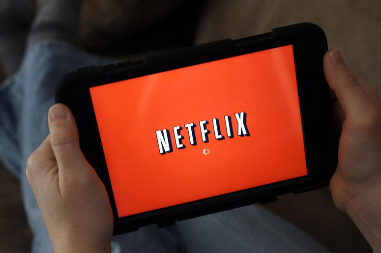 AP19077580844265 In this Friday, Jan. 17, 2014, file photo, a person displays Netflix on a tablet in North Andover, Mass. (AP Photo/Elise Amendola, File)