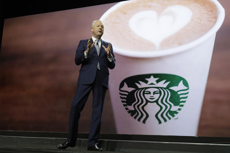 AP19079695149148 Starbucks CEO Kevin Johnson speaks Wednesday, March 20, 2019, at the company's annual shareholders meeting in Seattle. (AP Photo/Ted S. Warren)