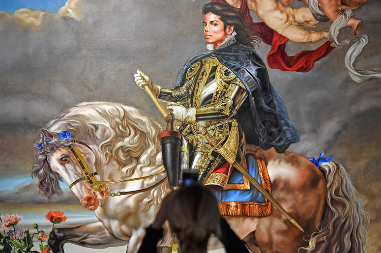 AP19080417910737 A visitor takes a smartphone picture of the painting 'Equestrian portrait of King Philipp II (Michael Jackson)' from US artist Kehinde Wiley at a preview of the exhibition 'Michael Jackson: On The Wall' at the Bundeskunsthalle museum in Bonn, Germany, Thu