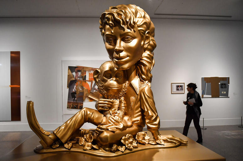 AP19080418465680 The sculpture 'Michael Jackson and Bubbles' from US artist Paul McCarthy' is presented at a preview of the exhibition 'Michael Jackson: On The Wall' at the Bundeskunsthalle museum in Bonn, Germany, Thursday, March 21, 2019. The exhibition around the contr