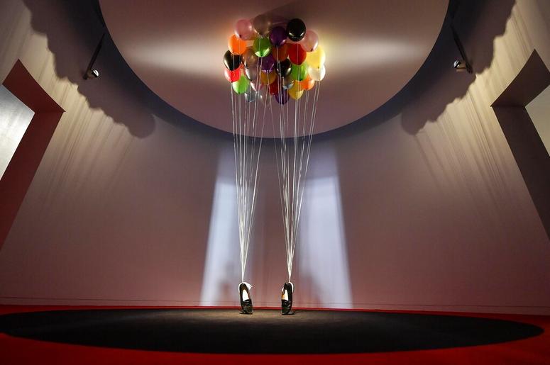 AP19080418958103 sculpture, comprised of balloons lifting a pair of penny loafer shoes by British artist Appau Junior Boakye-Yiadom is shown at a preview of the exhibition 'Michael Jackson: On The Wall' at the Bundeskunsthalle museum in Bonn, Germany, Thursday, March 21,