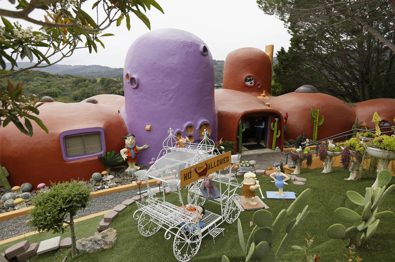 AP19091858524046 In this photo taken Monday, April 1, 2019, is an exterior view of the Flintstone House in Hillsborough, California. (AP Photo/Eric Risberg)