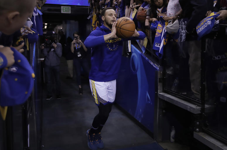 AP19099859876038 In this Sunday, April 7, 2019, photo, Golden State Warriors' Stephen Curry shoots from the players' entrance tunnel prior to the team's NBA basketball game against the Los Angeles Clippers in Oakland. (AP Photo/Ben Margot)