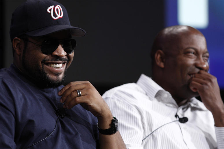 AP19120653716553 In this July 29, 2008, file photo, Ice Cube, left, and director John Singleton, laugh during the ESPN panel for the documentary series "30 for 30" at the Television Critics Association summer press tour in Pasadena, California. (AP Photo/Matt Sayles, File