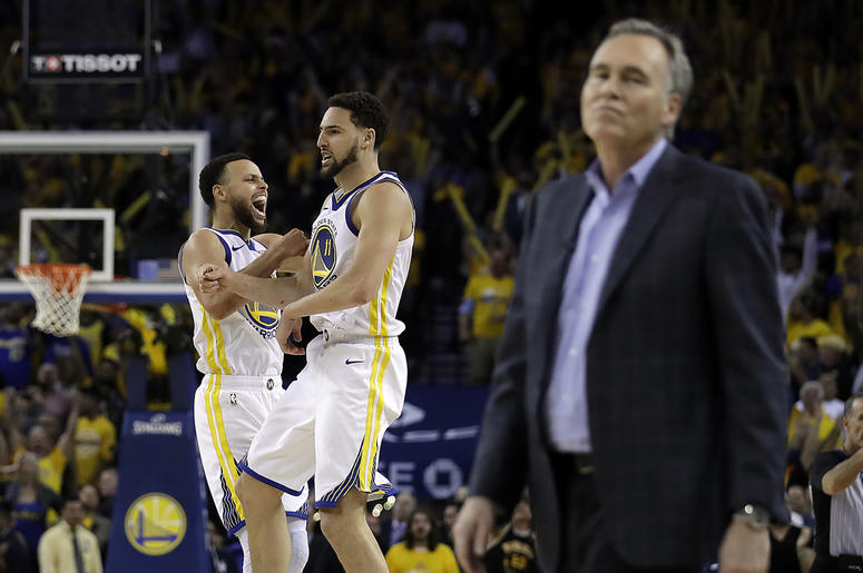AP19129233576066 Golden State Warriors' Stephen Curry, left, and Klay Thompson celebrate as Houston Rockets coach Mike D'Antoni walks onto the court during the second half of Game 5 of a second-round NBA basketball playoff series Wednesday, May 8, 2019, in Oakland, Calif.