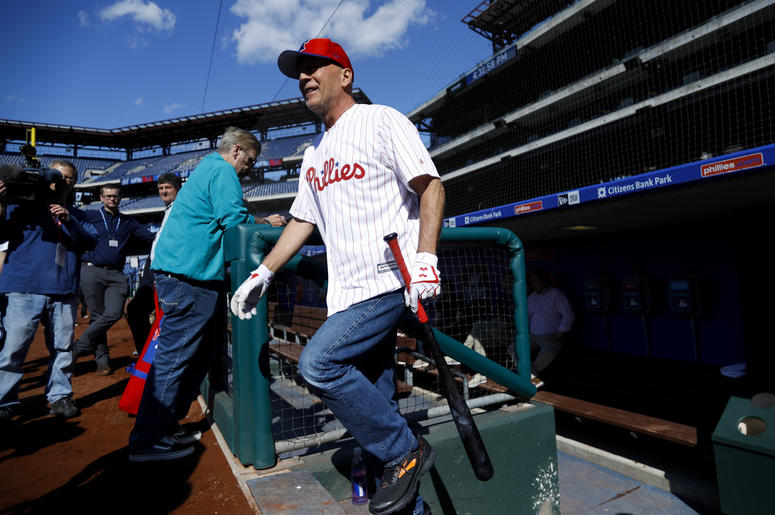 AP19135760088436 Actor Bruce Willis walks out of the Philadelphia Phillies' dugout to take batting practice before a baseball game against the Milwaukee Brewers, Wednesday, May 15, 2019, in Philadelphia. (AP Photo/Matt Slocum)